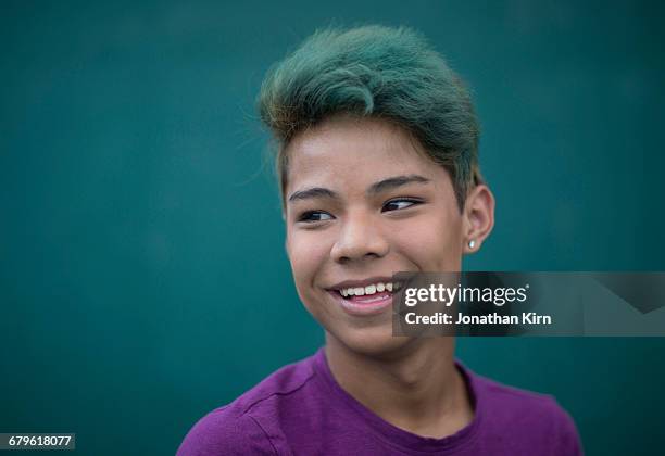transgender teenager portrait. - smiling boy in tshirt stockfoto's en -beelden