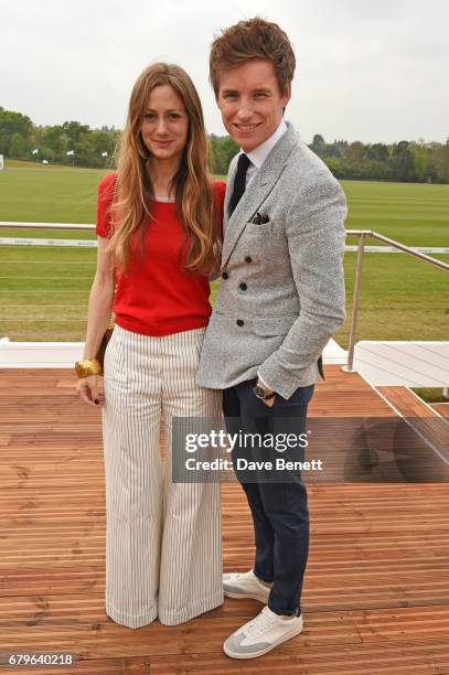 Hannah Bagshawe and Eddie Redmayne attend the Audi Polo Challenge at Coworth Park on May 6, 2017 in Ascot, United Kingdom.