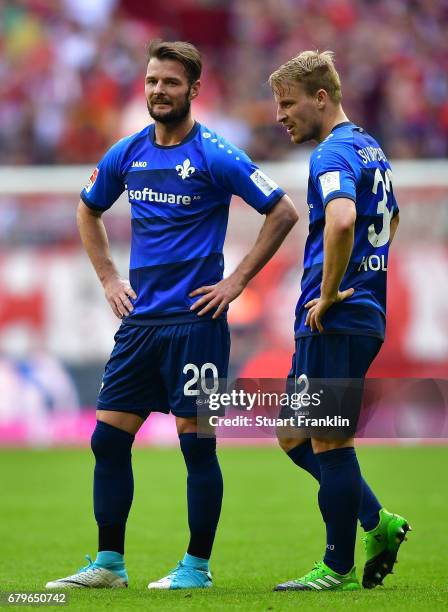 Marcel Heller and Fabian Holland of Dramstadt look dejected after the Bundesliga match between Bayern Muenchen and SV Darmstadt 98 at Allianz Arena...