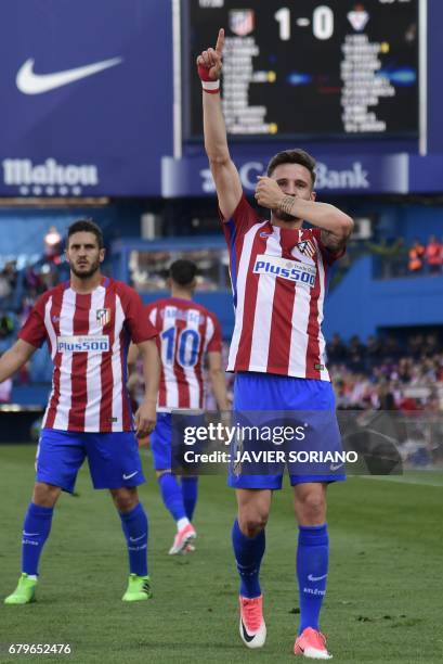 Atletico Madrid's midfielder Saul Niguez celebrates after scoring during the Spanish league football match Club Atletico de Madrid vs SD Eibar at the...