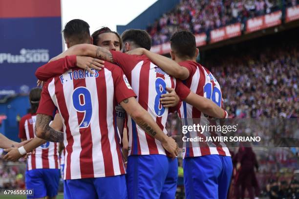 Atletico Madrid players celebrate after scoring during the Spanish league football match Club Atletico de Madrid vs SD Eibar at the Vicente Calderon...