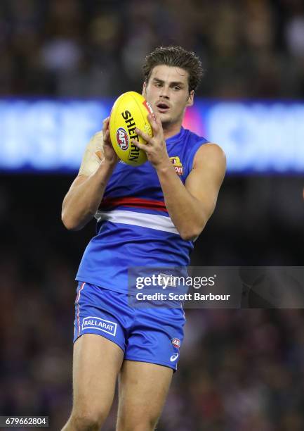 Tom Boyd of the Bulldogs runs with the ball during the round seven AFL match between the Western Bulldogs and the Richmond Tigers at Etihad Stadium...