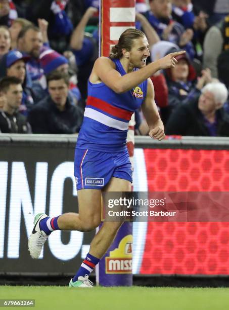 Marcus Bontempelli of the Bulldogs celebrates after kicking a goal during the round seven AFL match between the Western Bulldogs and the Richmond...