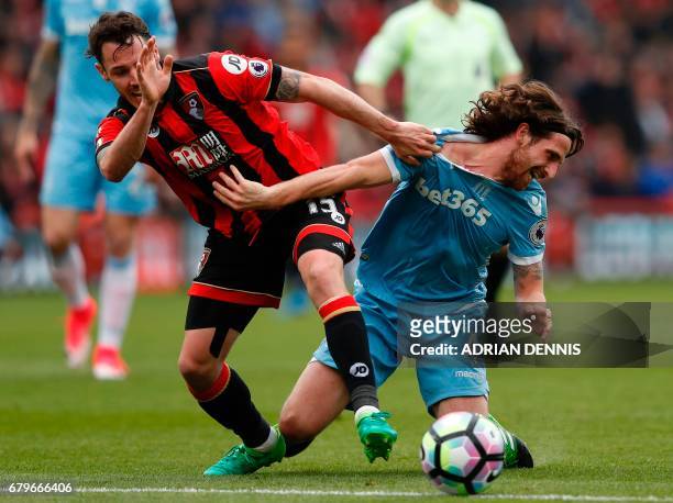 Bournemouth's English defender Adam Smith vies with Stoke City's Welsh midfielder Joe Allen during the English Premier League football match between...
