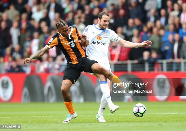 Abel Hernandez of Hull City vies with John O'Shea of Sunderland during the Premier League match between Hull City and Sunderland at KCOM Stadium on...