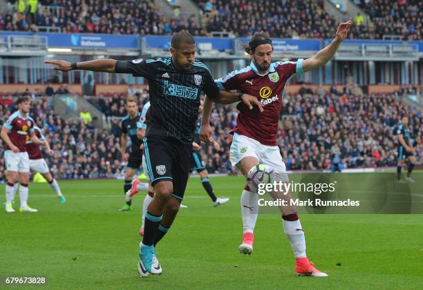 Jose Salomon Rondon of West Bromwich Albion and George Boyd of Burnley battle for possession during the Premier League match between Burnley and West...