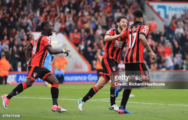 Joshua King of AFC Bournemouth celebrates Ryan Shawcross of Stoke City scoring a own goal for AFC Bournemouth's second goal with Harry Arter of AFC...