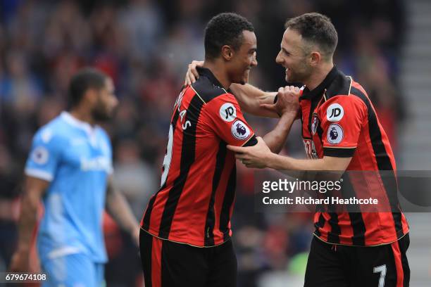 Junior Stanislas of AFC Bournemouth celebrates scoring his sides first goal with Marc Pugh of AFC Bournemouth during the Premier League match between...