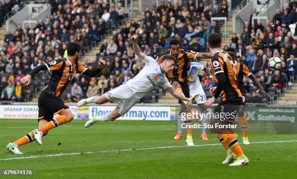 Billy Jones of Sunderland scores his sides first goal with a diving header during the Premier League match between Hull City and Sunderland at the...
