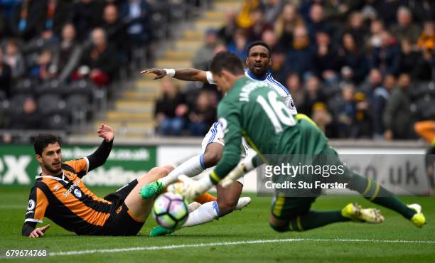 Hull goalkeeper Eldin Jakupovic saves a shot from Jermain Defoe of Sunderland during the Premier League match between Hull City and Sunderland at...