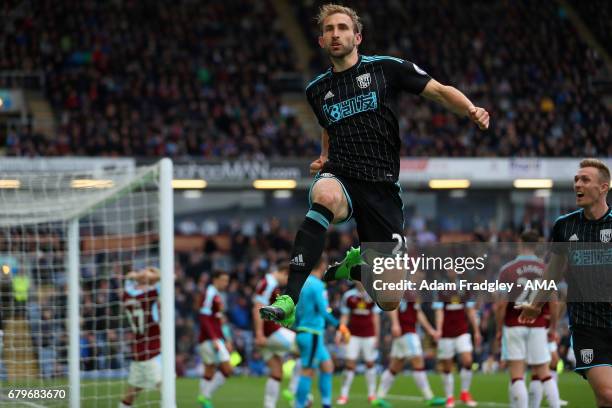 Craig Dawson of West Bromwich Albion celebrates after scoring a goal to make it 1-2 during the Premier League match between Burnley and West Bromwich...