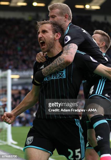 Craig Dawson of West Bromwich Albion celebrates after scoring a goal to make it 1-2 during the Premier League match between Burnley and West Bromwich...