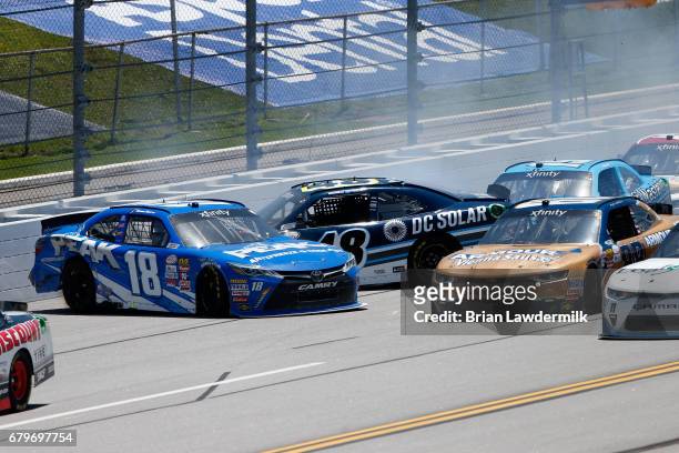 Daniel Suarez, driver of the Peak Antifreeze & Coolant Toyota, and Brennan Poole, driver of the DC Solar Chevrolet, have an on track incident during...