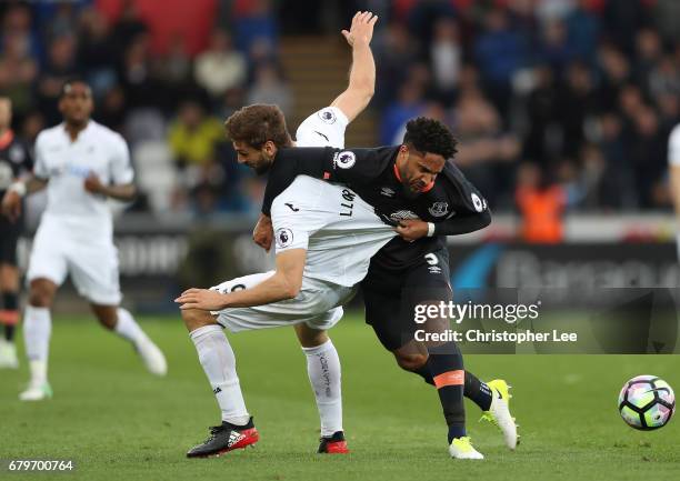 Fernando Llorente of Swansea City and Ashley Williams of Everton battle for possession during the Premier League match between Swansea City and...