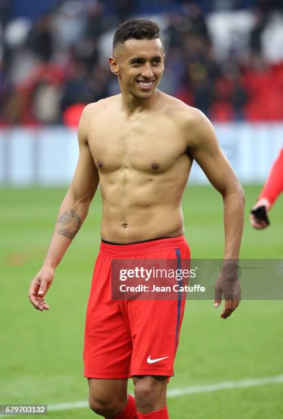 Shirtless Marquinhos of PSG looks on following the French Ligue 1 match between Paris Saint-Germain and SC Bastia at Parc des Princes stadium on May...