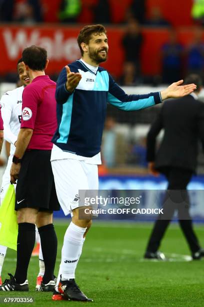 Goalscorer, Swansea City's Spanish striker Fernando Llorente celebrates on the pitch after the English Premier League football match between Swansea...