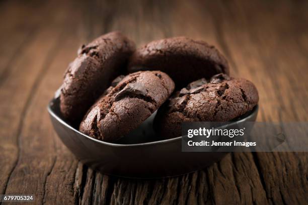 bowl of chocolate chip cookies. - chocolate biscuit cake stock pictures, royalty-free photos & images