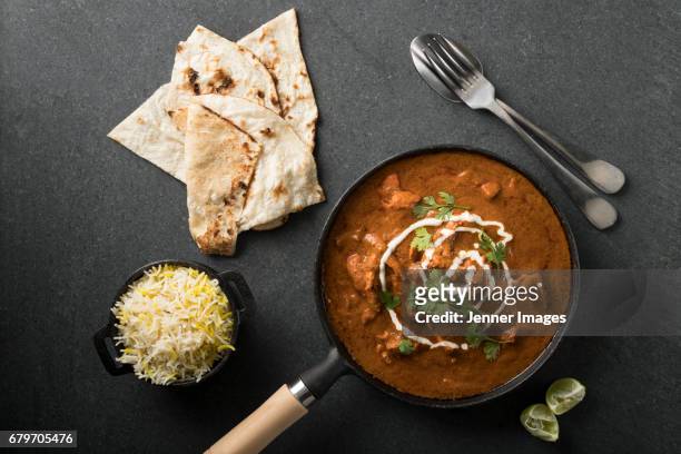 high angle view of butter chicken curry. - indian curry stock-fotos und bilder