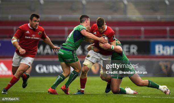 Munster , Ireland - 6 May 2017; Jack ODonoghue of Munster is tackled by John Cooney, left, and Finlay Bealham of Connacht during the Guinness PRO12...