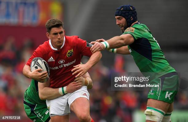 Munster , Ireland - 6 May 2017; Ian Keatley of Munster is tackled by Shane Delahunt and John Muldoon, right, of Connacht during the Guinness PRO12...