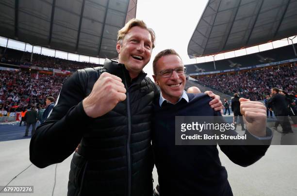 Head coach Ralph Hasenhuettl and Ralf Rangnick of RB Leipzig celebrate the participation of the UEFA Champions League in the next season after...