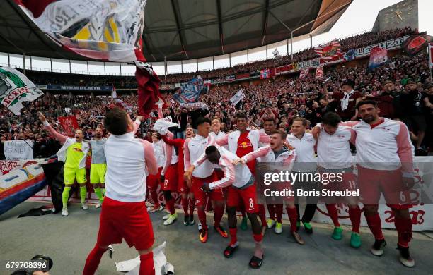 The team of RB Leipzig celebrate the participation of the UEFA Champions League in the next season after winning the Bundesliga match between Hertha...