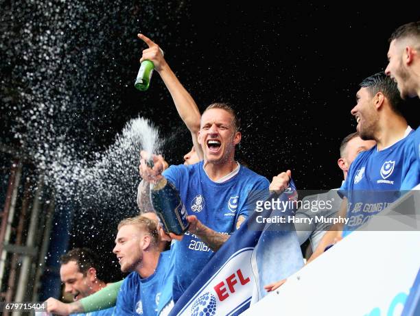 Portsmouth players celebrate winning the league after the Sky Bet League Two match between Portsmouth and Cheltenham Town at Fratton Park on May 6,...
