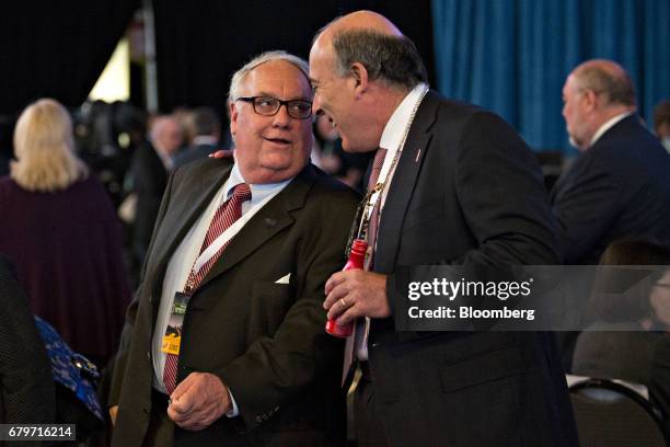 Howard Buffett, son of Warren Buffett and chief executive officer of the Howard G Buffett Foundation, left, speaks with Muhtar Kent, chairman and...