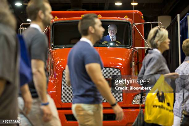 Cardboard cut out in the likeness of Warren Buffett, chairman and chief executive officer of Berkshire Hathaway Inc., sits in the driver's seat of a...