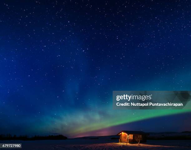 aurora in iceland - snowy hill stock pictures, royalty-free photos & images