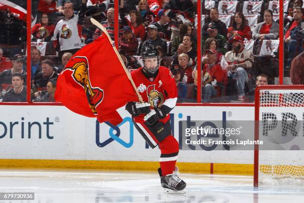 Scotiabank skater takes to the ice carrying a flag during player introductions prior to Game Five of the Eastern Conference Second Round opposing the...