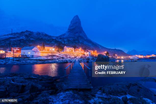 twilight time of idyllic coastal village at reine in winter, norway - moskenesoya stock pictures, royalty-free photos & images