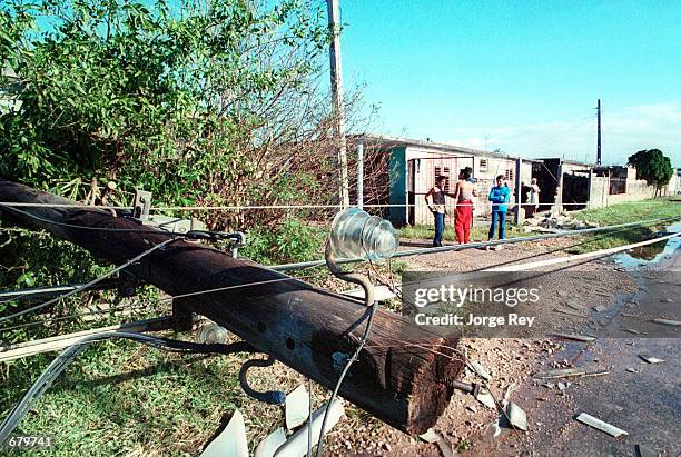 Downed power lines caused by Hurricane Michelle lay on the ground November 5, 2001 in Jaguey, Cuba.