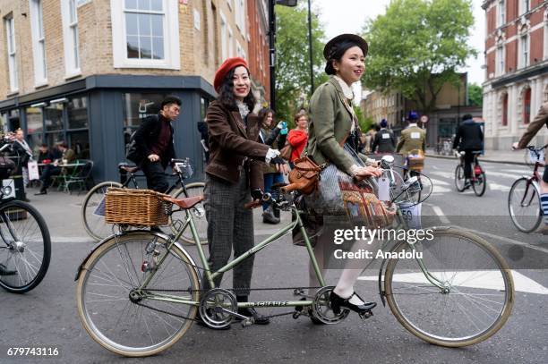 Cyclists wearing vintage clothing and attire take part in the annual Tweed Run riding around the streets and sights in London, United Kigdom on May...