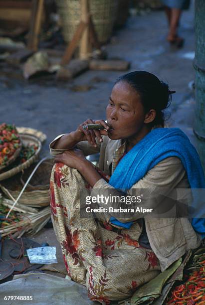 Woman smoking a cheroot in Taunggyi, Burma , February 1988.
