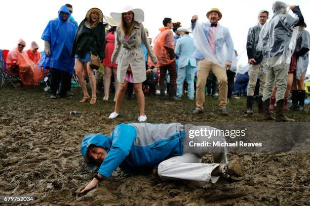 Fans make their way through the infield prior to the 143rd running of the Kentucky Derby at Churchill Downs on May 6, 2017 in Louisville, Kentucky.