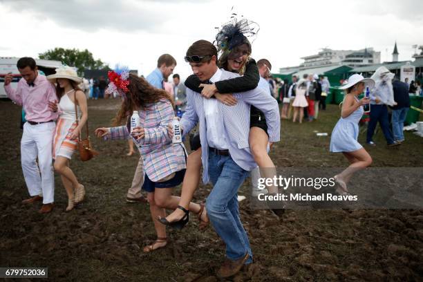 Fans make their way through the infield prior to the 143rd running of the Kentucky Derby at Churchill Downs on May 6, 2017 in Louisville, Kentucky.