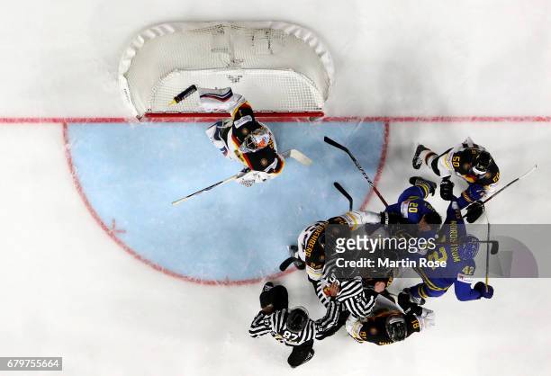 Yasin Ehliz of Germany fights with Joel Lundqvist of Swede during the 2017 IIHF Ice Hockey World Championship game between Germany and Sweden at...