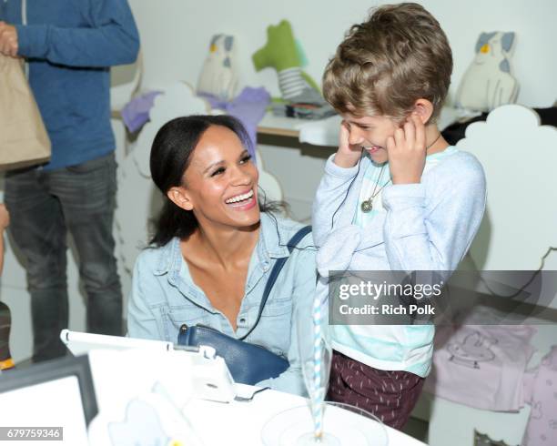 Actress Amanda Luttrell Garrigus and her daughter attend and event where actress Ali Larter Hosts Stop, Breathe & Think Kids App Launch at Rabbit...