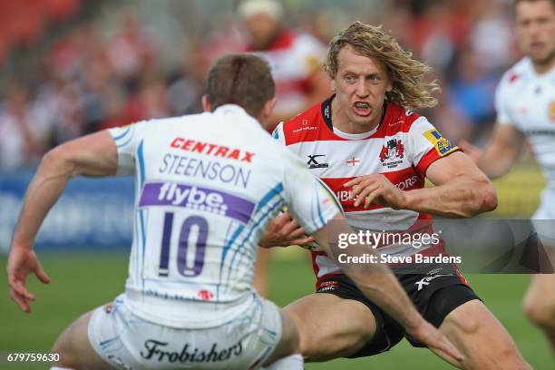 Billy Twelvetrees of Gloucester Rugby takes on Gareth Steenson of Exeter Chiefs during the Aviva Premiership match between Gloucester Rugby and...