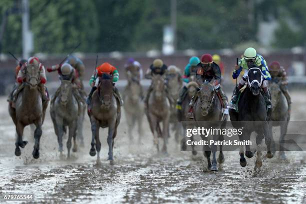 Jockey John Velazquez celebrates as he guides Always Dreaming across the finish line to win the 143rd running of the Kentucky Derby at Churchill...