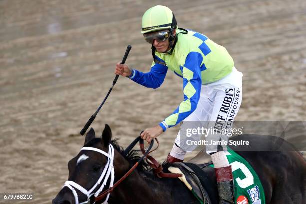 Jockey John Velazquez celebrates as he guides Always Dreaming across the finish line to win the 143rd running of the Kentucky Derby at Churchill...