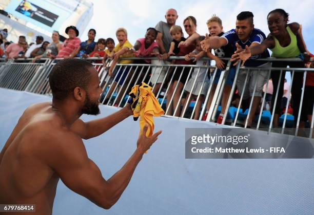 Gavin Christie of Bahamas gives his shirt away to fans after the FIFA Beach Soccer World Cup Bahamas 2017 Exhibition match between Bahamas and FIFA...