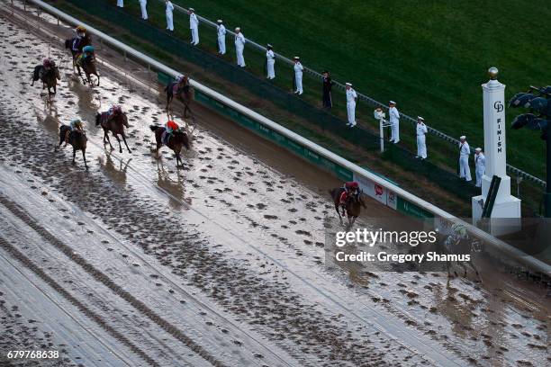 Jockey John Velazquez celebrates as he guides Always Dreaming across the finish line to win the 143rd running of the Kentucky Derby at Churchill...