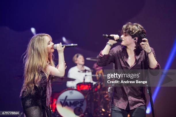 Sabrina Carpenter joins Bradley Simpson of The Vamps on stage at Manchester Arena on May 6, 2017 in Manchester, England.