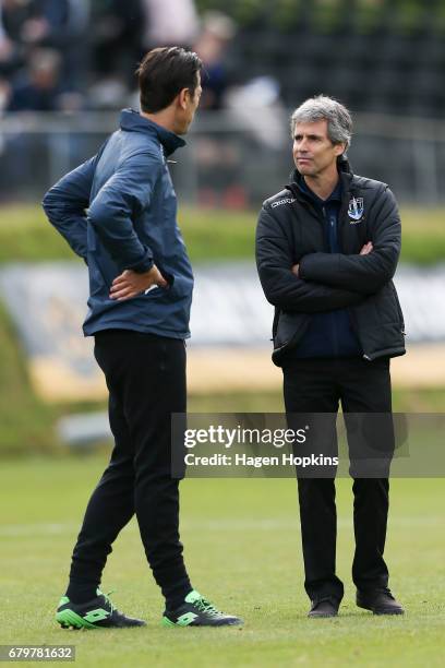 Coach Ramon Tribulietx and assistant coach Ivan Vicelich of Auckland City talk during the OFC Champions League Final match between Team Wellington...