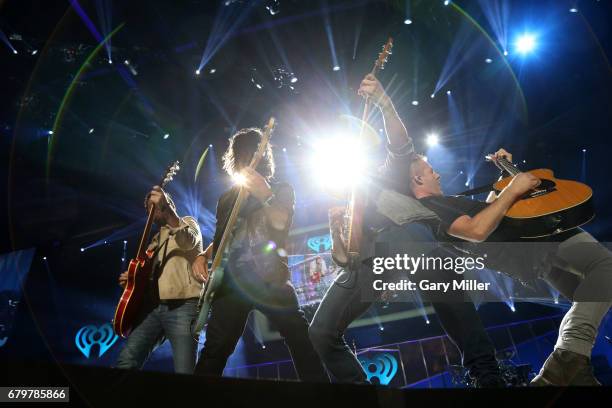 Musicians Brad Tursi, Geoff Sprung, Matthew Ramsey, and Trevor Rosen of Old Dominion performs onstage during the 2017 iHeartCountry Festival, A Music...