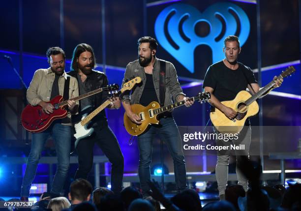 Musicians Brad Tursi, Geoff Sprung, Matthew Ramsey and Trevor Rosen of Old Dominion perform onstage during the 2017 iHeartCountry Festival, A Music...