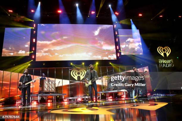 Musicians Geoff Sprung, Whit Sellers, Matthew Ramsey, and Brad Tursi of Old Dominion perform onstage during the 2017 iHeartCountry Festival, A Music...