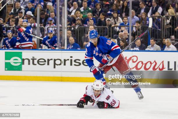 New York Rangers defenseman Marc Staal sends Ottawa Senators left wing Mike Hoffman to the ice during the first period of game 4 of the second round...